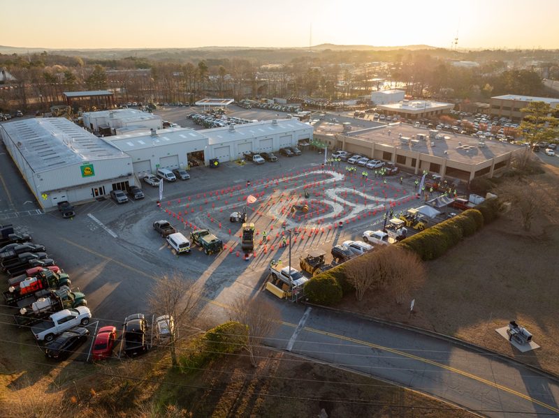 Sunrise aerial over the yard, the competition course laid out across the lot