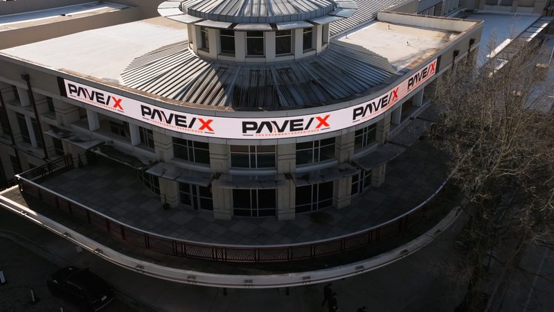Aerial of the convention centre with the Pave/X banners across the facade