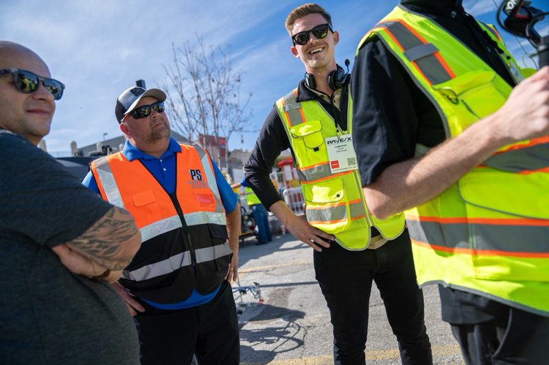 Crew laughing between runs at the demo lot
