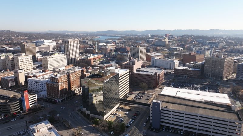Aerial across the downtown skyline and the river beyond