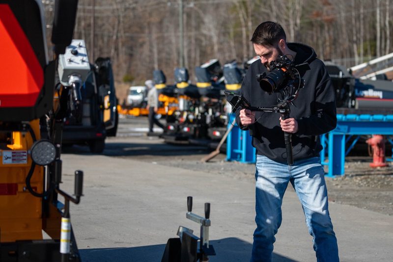 A shooter working a gimbal rig through the machine yard