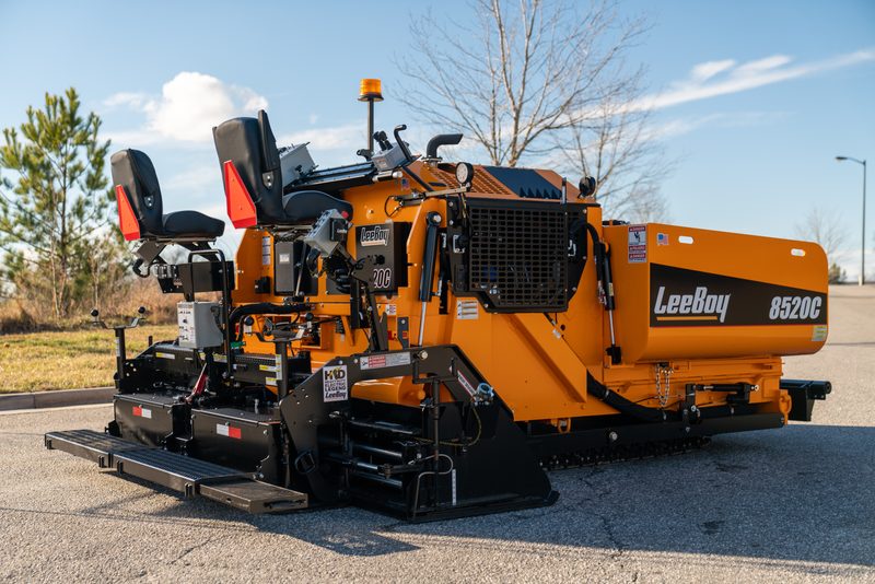 A LeeBoy 8520C paver in three-quarter view on fresh asphalt