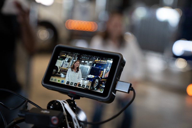 The interview framed on the camera monitor, everything else falling away