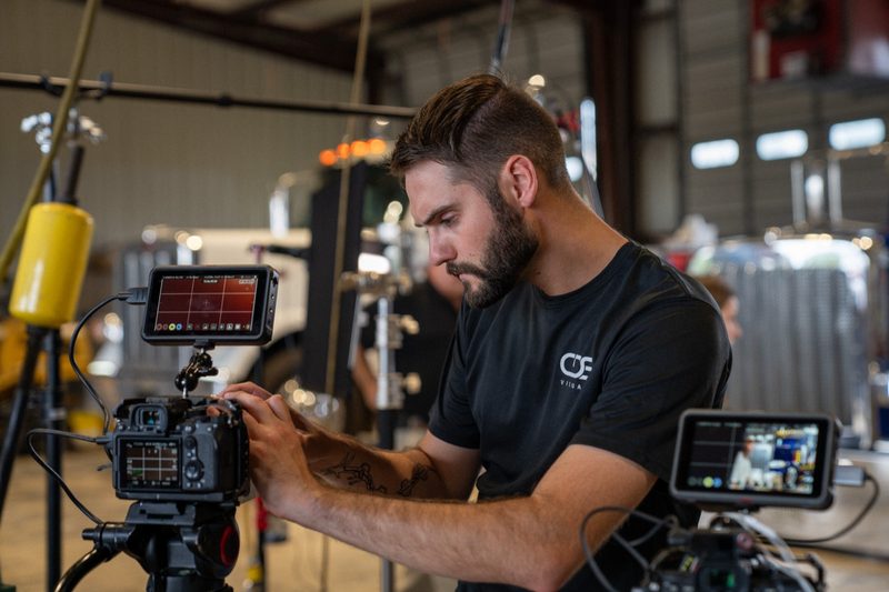 A shooter dialling in the camera on the shop floor