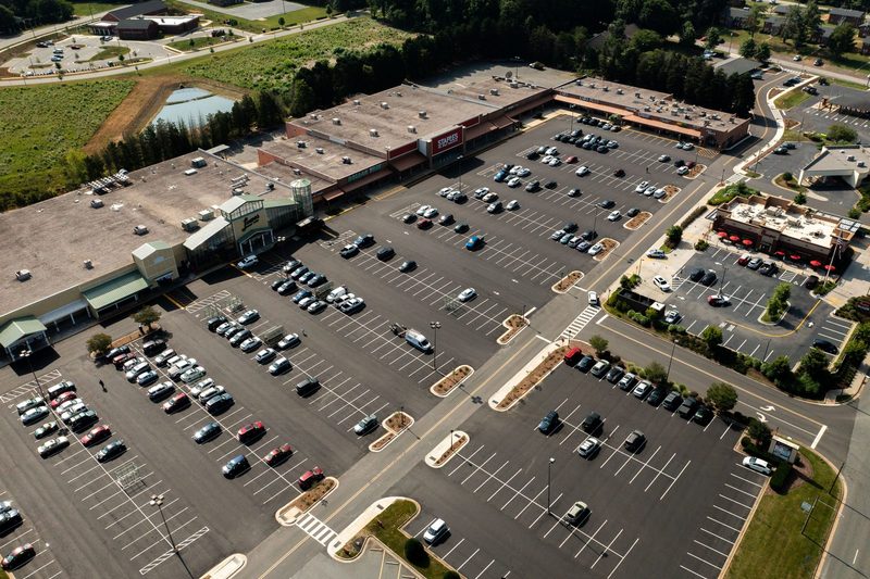 Aerial over the shopping centre lot, fresh stripes laid out