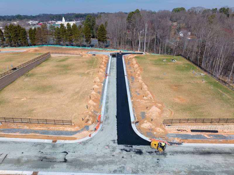 Aerial down the new drive cut between the graded banks