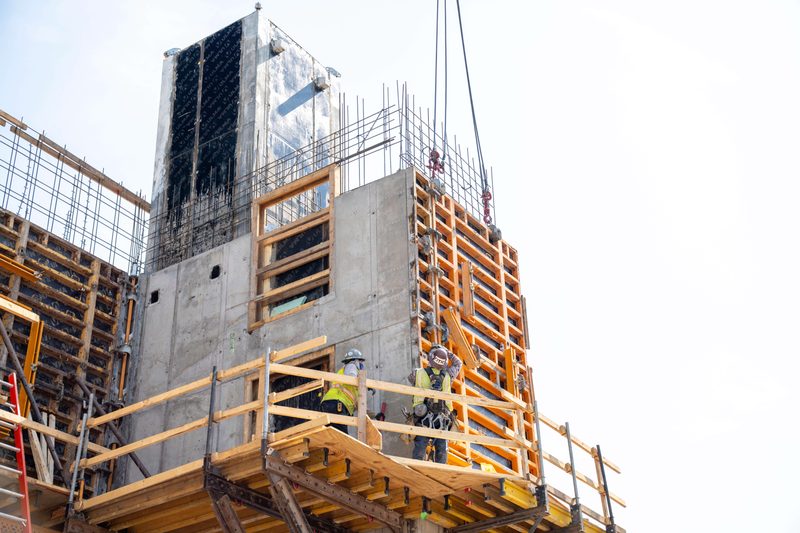 Climbing formwork riding the core up, a worker out on the platform