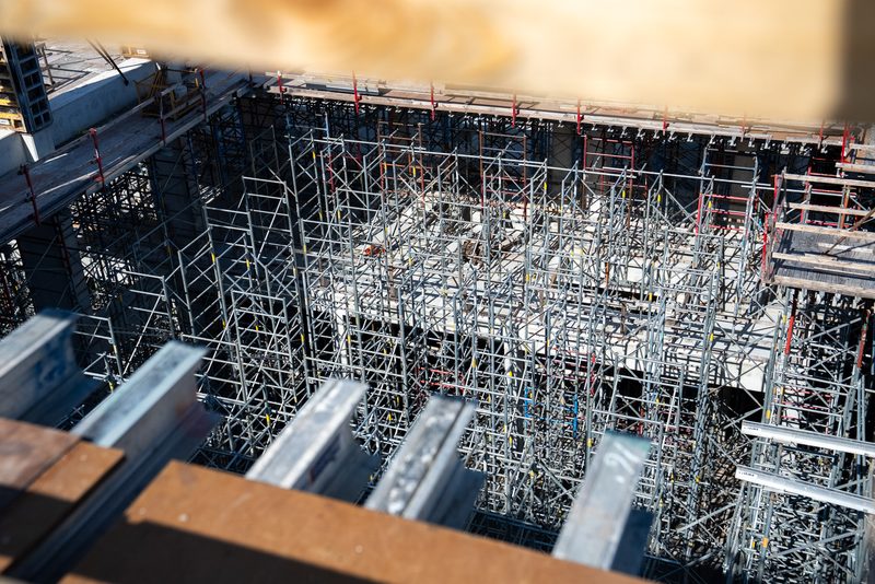 Looking down into the shoring, props and frames packed under the deck