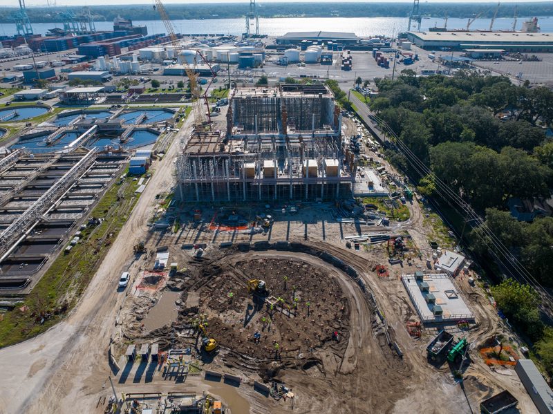 Aerial over the plant build, the port running along the far side