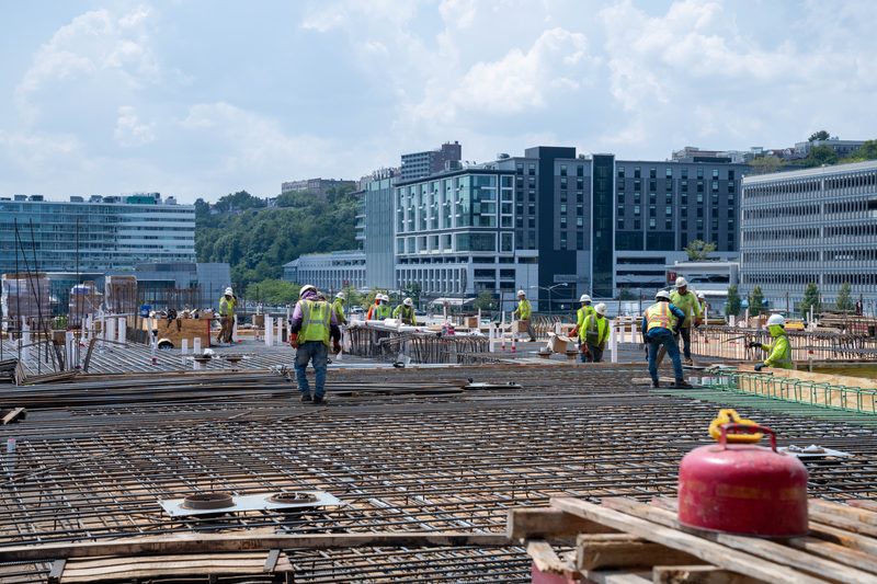 Crew working the rebar mat before the pour