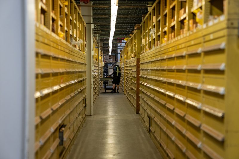Down the parts aisle, shelving stacked the length of the building