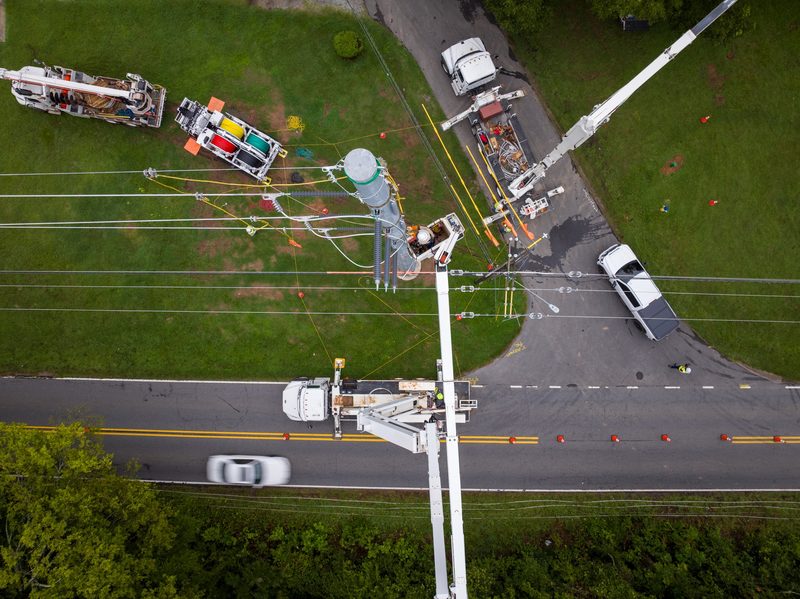Top-down over the intersection, conductors rigged and traffic running