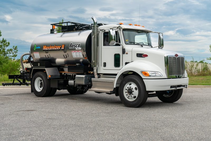 A LeeBoy eMax asphalt distributor, three-quarter rear hero angle
