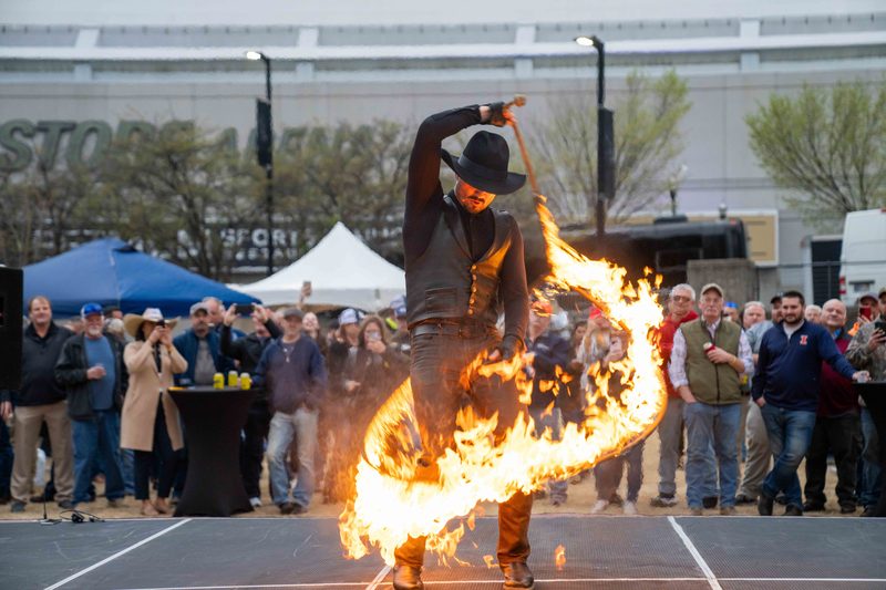 A fire performer working the crowd at BOMAG Live